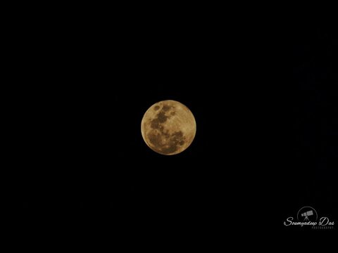 Golden hue of the rising 'Hunters Full Moon' in Varanasi, Northern India. Hunters full moon is the Anglo-Saxon name for the October full moon. One 1/160sec f/5.7 ISO800 image captured on Canon EOS 700D.