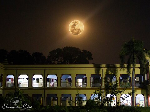 Overlaid the 2017 Hunters full moon over the moonlit evening sky at my undergrad hostel in IIT Varanasi. The hostel in foreground was captured at 1/5 second exposure, f/5.0, ISO3200. The moon was shot at 1/160sec, f/5.7, ISO800.